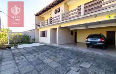 Imagem: A casa possui 3 Dormitórios, 4 Banheiros, 4 Vagas na garagem