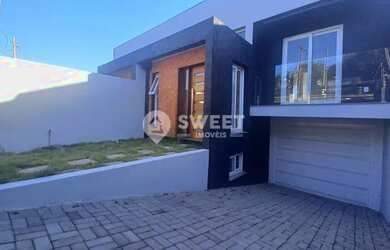 Imagem: A casa possui 3 Dormitórios, 2 Banheiros, 2 Vagas na garagem