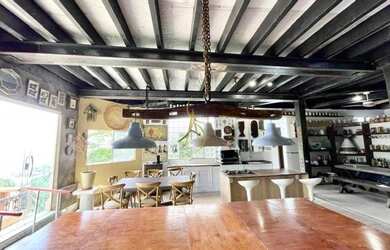 Imagem 6: Charmosa casa assinada por Zanina Caldas com encantadora vista panorâmica!