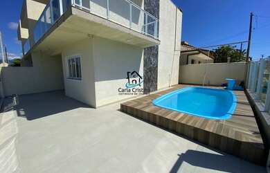 Imagem: A casa possui 3 Dormitórios, 2 Banheiros, 1 Vaga na garagem