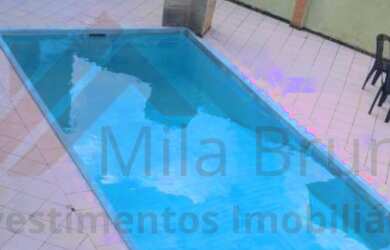 Imagem: A casa possui 3 Dormitórios, 3 Banheiros e 4 Vagas na garagem