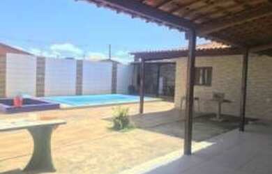 Imagem: A casa possui 3 Dormitórios, 2 Vagas na garagem e está localizado