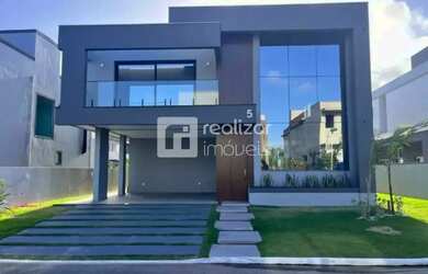 Imagem: A casa possui 4 Dormitórios, 5 Banheiros, 4 Vagas na garagem