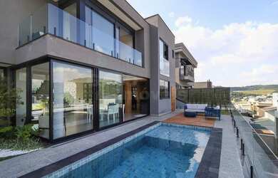 Imagem: A casa em condomínio possui 4 Dormitórios, 5 Banheiros, 4