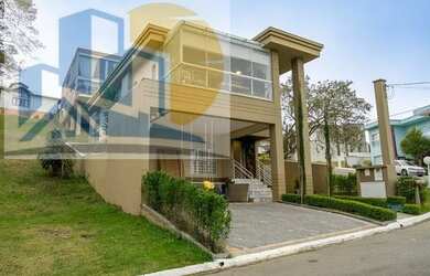 Imagem: A casa em condomínio possui 4 Dormitórios, 3 Banheiros, 2