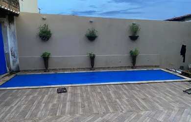 Imagem: A casa possui 3 Dormitórios, 3 Banheiros, 5 Vagas na garagem