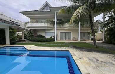 Imagem: A casa possui 5 Dormitórios, 5 Banheiros, 4 Vagas na garagem