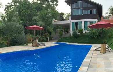 Imagem: A casa possui 3 Dormitórios, 5 Banheiros, 5 Vagas na garagem