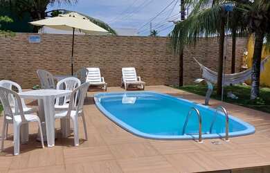 Imagem: A casa possui 5 Dormitórios, Acomodam 20 pessoas, 5 Vagas na