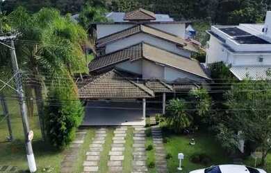 Imagem: A casa em condomínio possui 4 Dormitórios, 5 Banheiros, 4