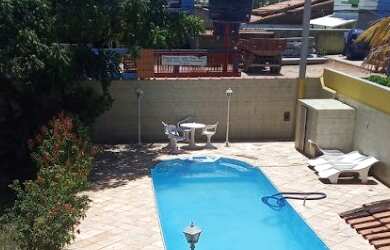 Imagem: A casa possui 3 Dormitórios, 2 Banheiros, 3 Vagas na garagem