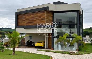 Imagem: A casa em condomínio possui 4 Dormitórios, 5 Banheiros, 5