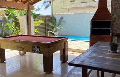 Imagem: A casa possui 2 Dormitórios, 3 Vagas na garagem e está localizado