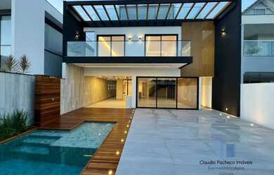 Imagem: A casa possui 5 Dormitórios, 5 Banheiros, 2 Vagas na garagem