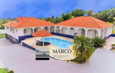 Imagem: A casa possui 5 Dormitórios, 5 Banheiros, 5 Vagas na garagem