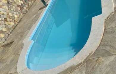 Imagem: A casa possui 2 Dormitórios, 5 Vagas na garagem e está localizado