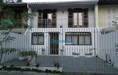 Imagem: A casa possui 3 Dormitórios, 2 Banheiros, 2 Vagas na garagem