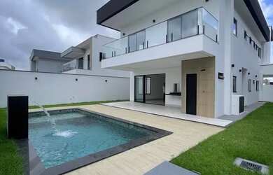 Imagem: A casa em condomínio possui 4 Dormitórios, 5 Banheiros, 4