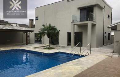 Imagem: A casa em condomínio e possui 4 Dormitórios, Suítes, 4 Banheiros