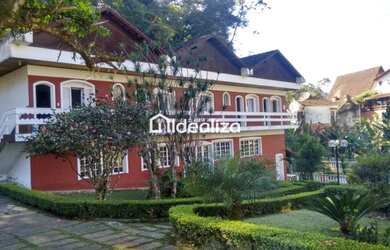 Imagem: A casa possui 5 Dormitórios, 5 Banheiros, 5 Vagas na garagem