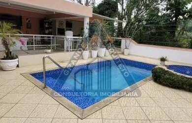 Imagem: A casa em condomínio possui 4 Dormitórios, 5 Banheiros, 3