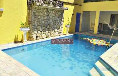 Imagem: A casa possui 3 Dormitórios, 5 Banheiros, 5 Vagas na garagem