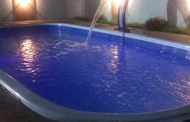 Imagem: A casa possui 2 Dormitórios, 3 Vagas na garagem e está localizado