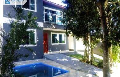 Imagem: A casa possui 3 Dormitórios, 3 Banheiros, 4 Vagas na garagem