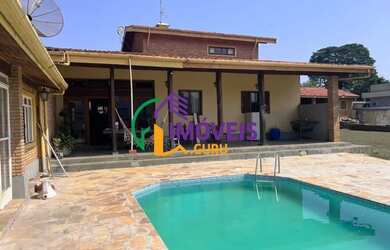 Imagem: A casa possui 5 Dormitórios, 4 Banheiros, 5 Vagas na garagem