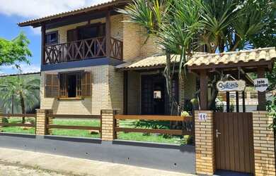 Imagem: A casa possui 4 Dormitórios, 4 Vagas na garagem e está localizado