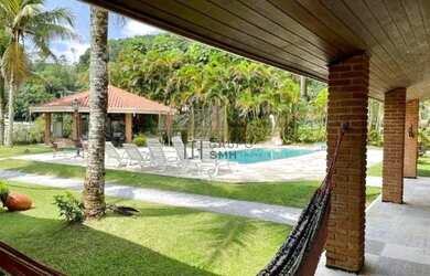 Imagem: A casa em condomínio possui 5 Dormitórios, 4 Banheiros, 5