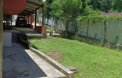 Imagem: A casa possui 2 Dormitórios, 3 Vagas na garagem e está localizado