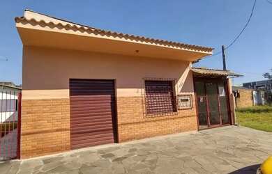 Imagem: A casa possui 3 Dormitórios, 3 Banheiros, 2 Vagas na garagem