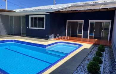 Imagem: A casa possui 3 Dormitórios, 3 Banheiros, 5 Vagas na garagem