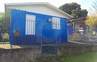 Imagem: A casa e possui 2 Dormitórios, Suítes, 1 Banheiro, 1 Vaga