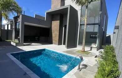 Imagem: A casa possui 4 Dormitórios, 4 Banheiros, 4 Vagas na garagem