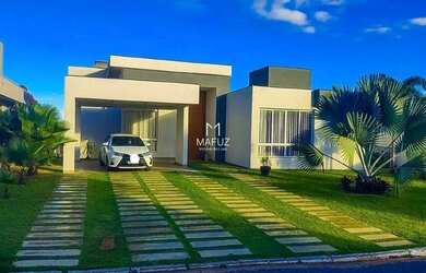 Imagem: A casa possui 4 Dormitórios, 5 Banheiros, 4 Vagas na garagem