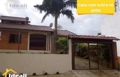 Imagem: A casa possui 2 Dormitórios, 1 Banheiro, 1 Vaga na garagem