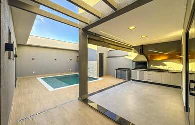 Imagem: A casa possui 3 Dormitórios, 5 Banheiros, 4 Vagas na garagem