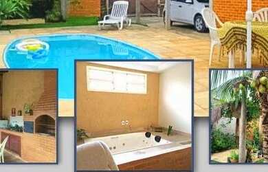 Imagem: A casa possui 3 Dormitórios, 3 Banheiros, 3 Vagas na garagem