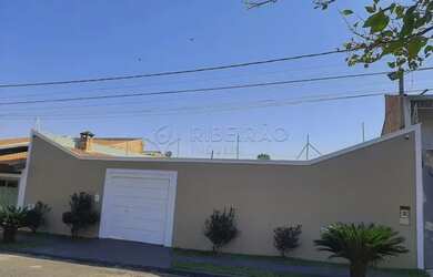 Imagem: A casa possui 2 Dormitórios, 3 Banheiros, 4 Vagas na garagem