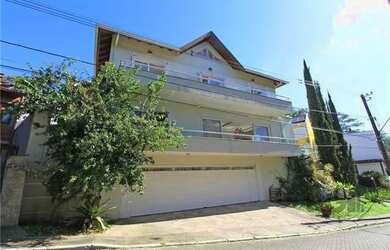 Imagem: A casa em condomínio possui 5 Dormitórios, 5 Banheiros, 4