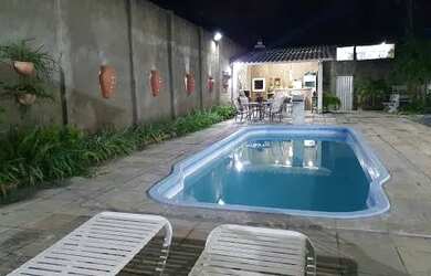 Imagem: A casa possui 5 Dormitórios, 2 Banheiros, 5 Vagas na garagem