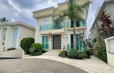 Imagem: A casa possui 5 Dormitórios, 5 Banheiros, 5 Vagas na garagem