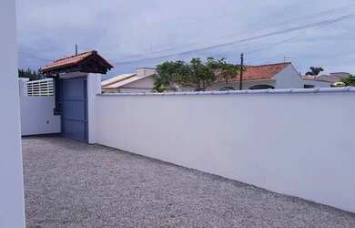 Imagem: A casa possui 3 Dormitórios, 3 Banheiros, 3 Vagas na garagem