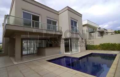 Imagem: A casa possui 4 Dormitórios, 4 Banheiros, 5 Vagas na garagem