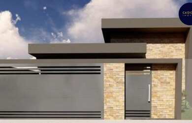 Imagem: A casa possui 3 Dormitórios, 2 Banheiros, 2 Vagas na garagem