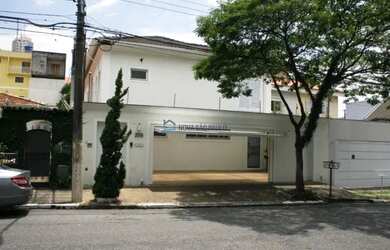 Imagem: A casa possui 3 Dormitórios, 5 Banheiros, 4 Vagas na garagem