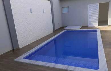 Imagem: A casa possui 3 Dormitórios, 4 Banheiros, 2 Vagas na garagem