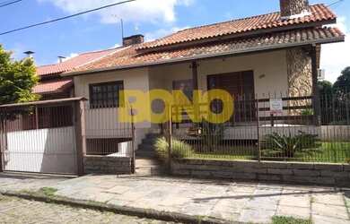 Imagem: A casa possui 3 Dormitórios, 2 Banheiros, 2 Vagas na garagem